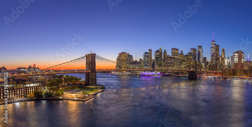 New York City downtown buildings skyline Brooklyn Bridge sunset evening night