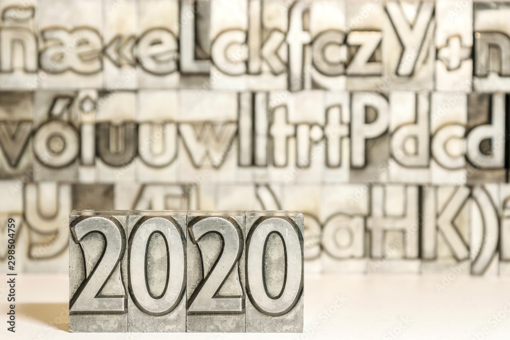 Happy new year 2020 on background with press types Happy new year 2020 on background with press types
