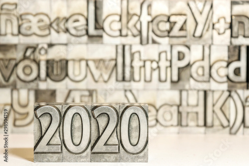 Happy new year 2020 on background with press types © jlrueda