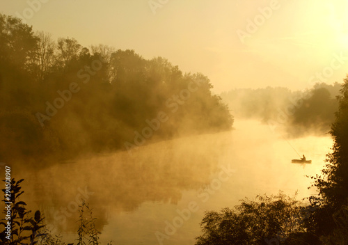 Fisherman at Sunrise on a Boat 