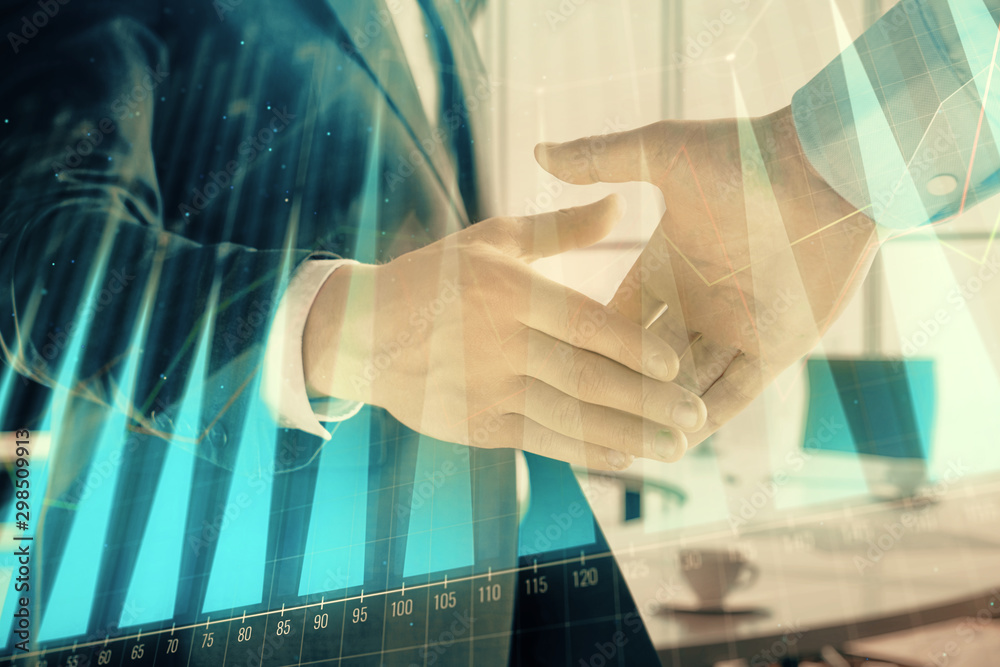 Multi exposure of financial graph on office background with two businessmen handshake. Concept of success in business Multi exposure of financial graph on office background with two businessmen handshake. Concept of success in business