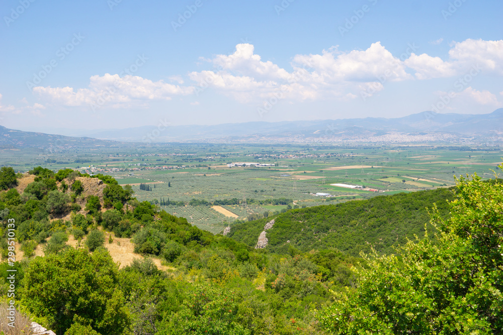Fertile agricultural growing fields between mountains.