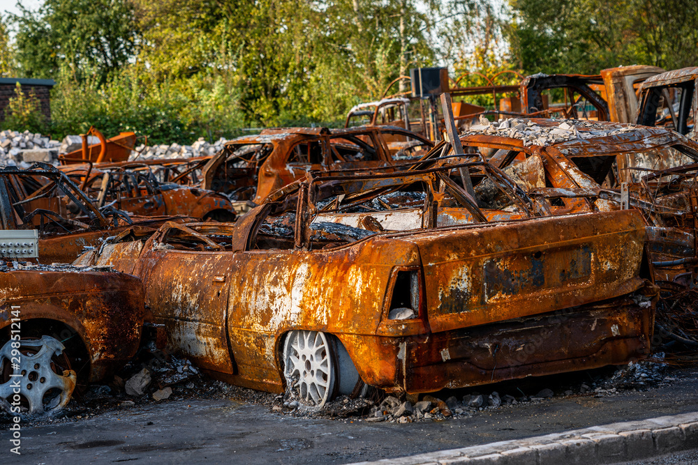 rusted burnt out car wrecks