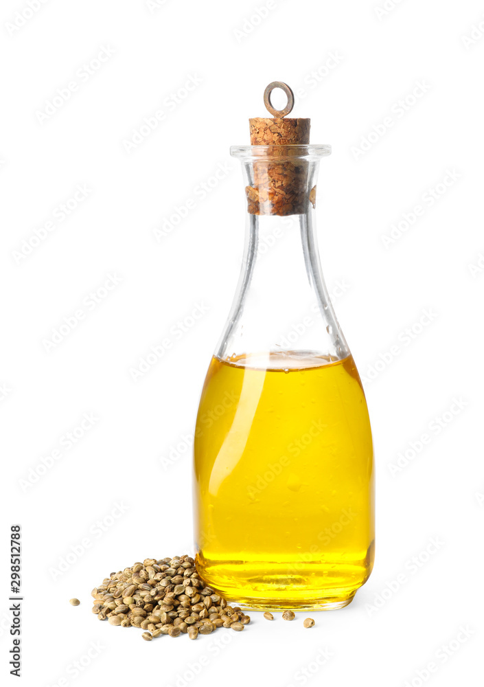 Bottle with hemp oil and seeds on white background Bottle with hemp oil and seeds on white background