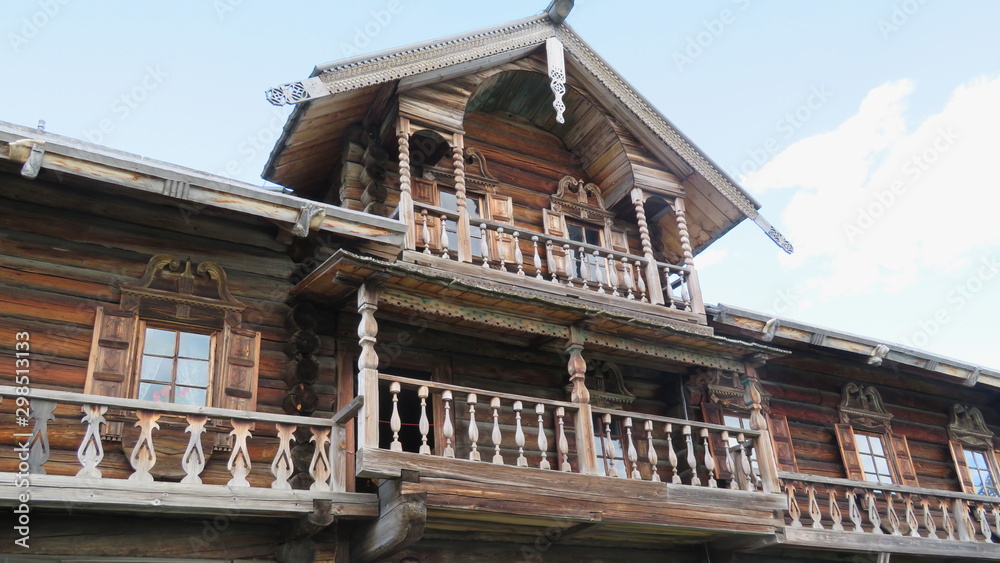 Sights of Russia, Karelia, a Fragment of an old wooden house with balcony on Kizhi island in lake Onega on a summer day