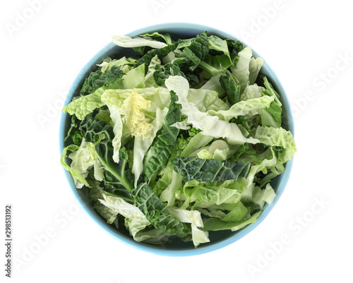 Chopped fresh green savoy cabbage in bowl on white background, top view