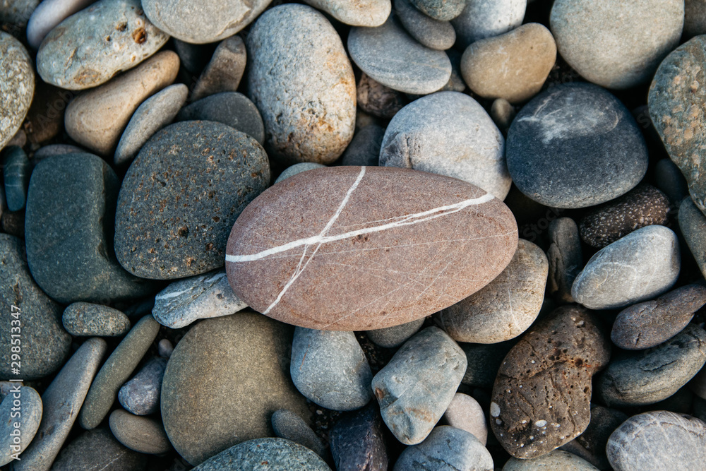 Gravel pattern of colored stones. Abstract nature pebbles background. Stone background. Sea peblles beach. Top view. Gravel pattern of colored stones. Abstract nature pebbles background. Stone background. Sea peblles beach. Top view.