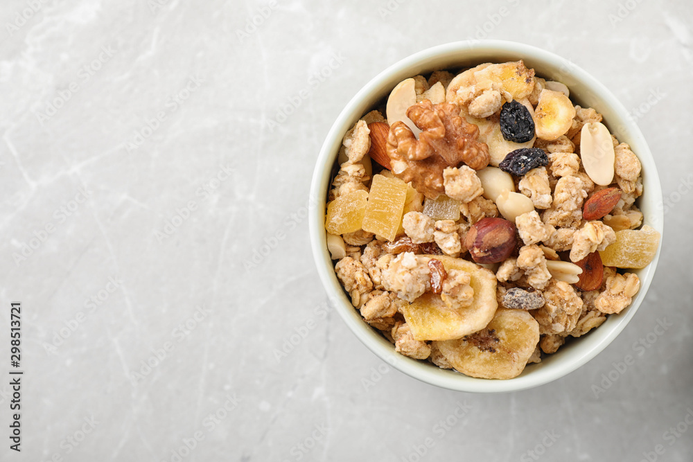 Tasty homemade granola on light table, top view with space for text. Healthy breakfast Tasty homemade granola on light table, top view with space for text. Healthy breakfast