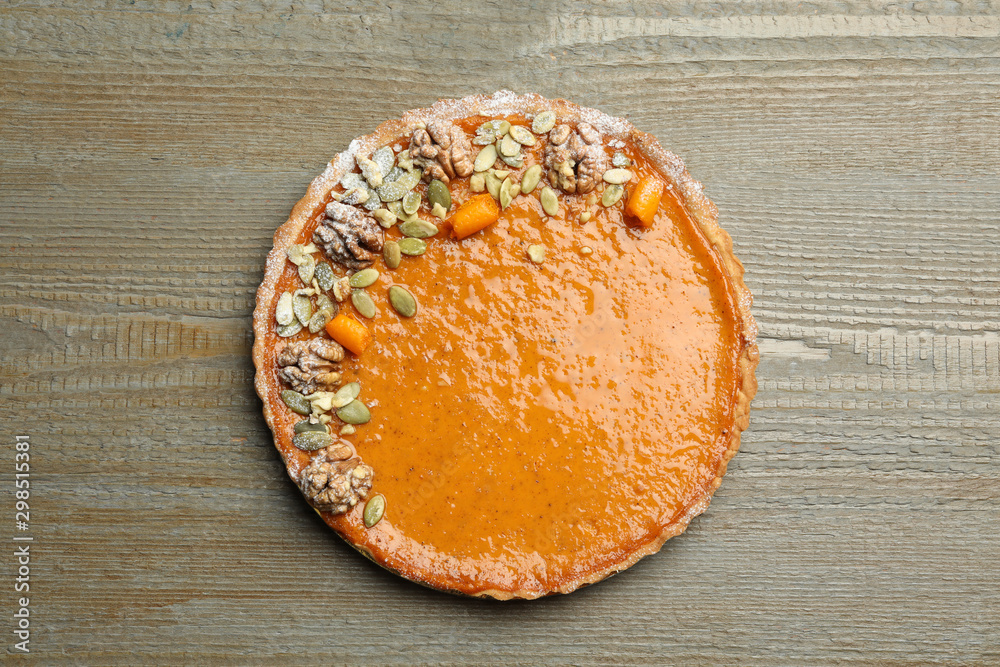 Delicious fresh homemade pumpkin pie on wooden table, top view Delicious fresh homemade pumpkin pie on wooden table, top view