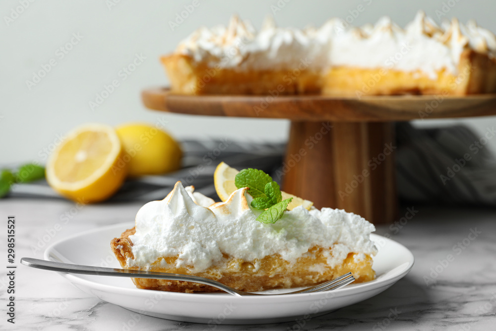 Delicious lemon meringue pie served on white marble table Delicious lemon meringue pie served on white marble table