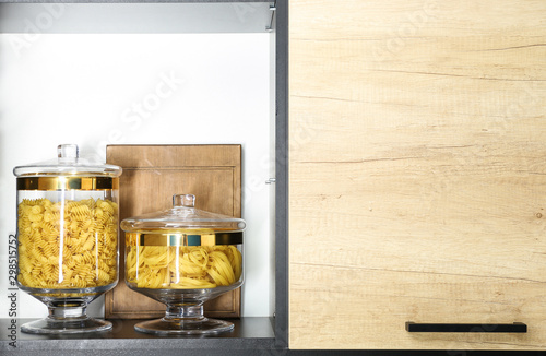 Products in modern kitchen glass containers on shelf