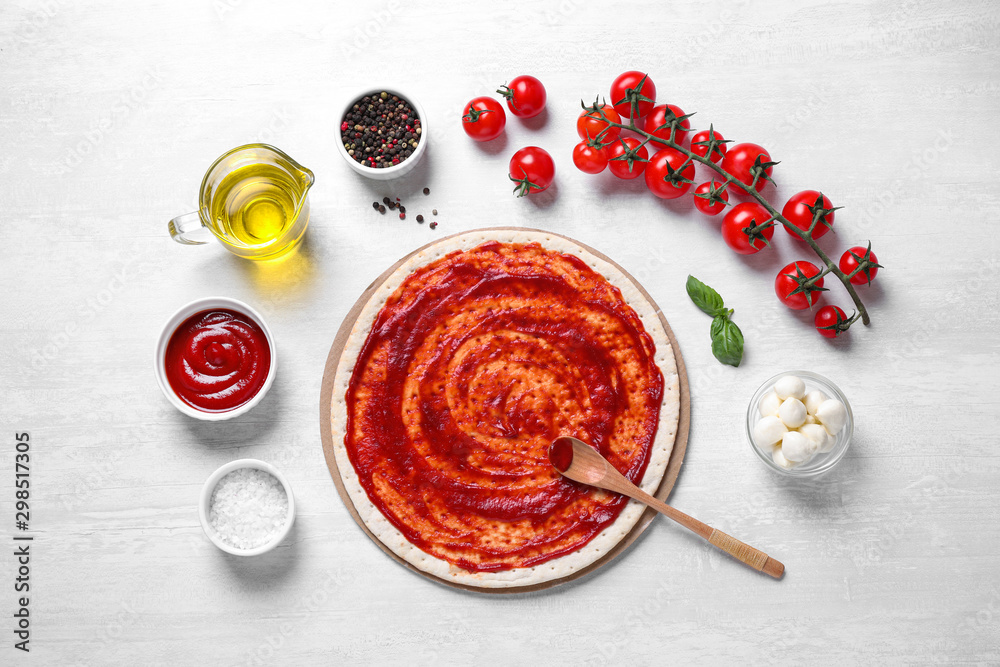 Flat lay composition with fresh ingredients for pizza Margherita on white table Flat lay composition with fresh ingredients for pizza Margherita on white table
