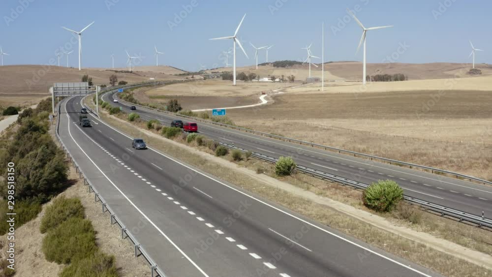 Wind turbines in motion along road Wind turbines in motion along road