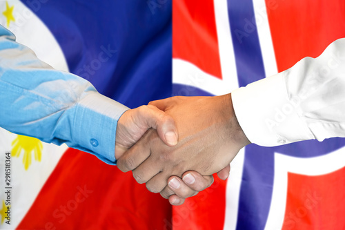 Business handshake on the background of two flags. Men handshake on the background of the Philippines and Norway flag. Support concept