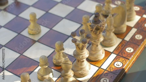 Old man opens the chess game with white pawn on E4