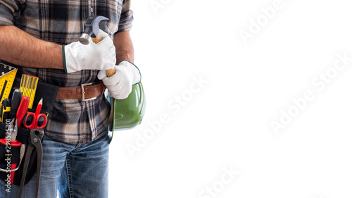 Adult craftsman carpenter isolated on white background; he wears leather work gloves, he is holding a carpenter’s hammer. Work tools industry construction and do it yourself housework. Stock photo.