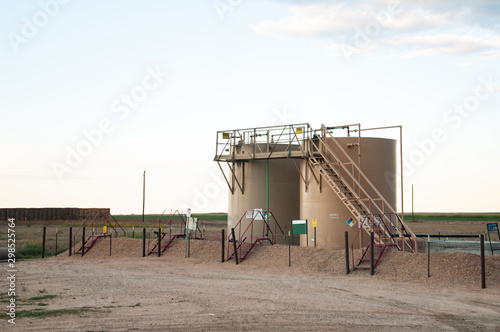 Two tanks used to store crude oil after it is pumped from the ground.