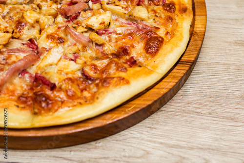 Pizza on wooden table background. Delicious pizza on wooden table. Top view with copy space