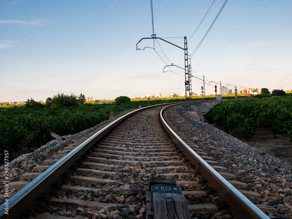 Obraz premium train tracks, level crossing and moving rail