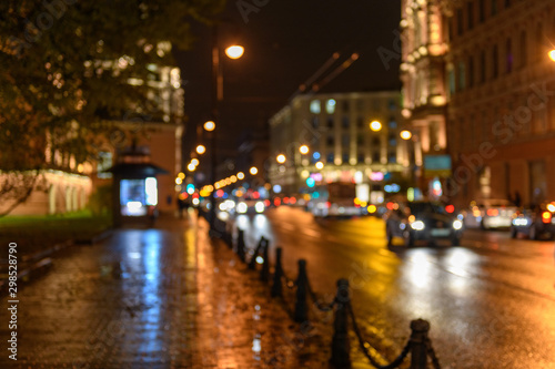 View of traffic in city street, night scape, blured bokeh background © Alexey Seafarer