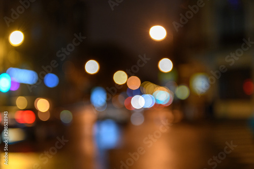 View of traffic in city street, night scape, blured bokeh background © Alexey Seafarer