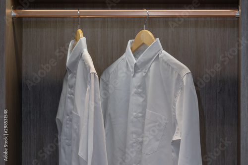 Men shirt hang in a wooden closet at modern home © pomphotothailand