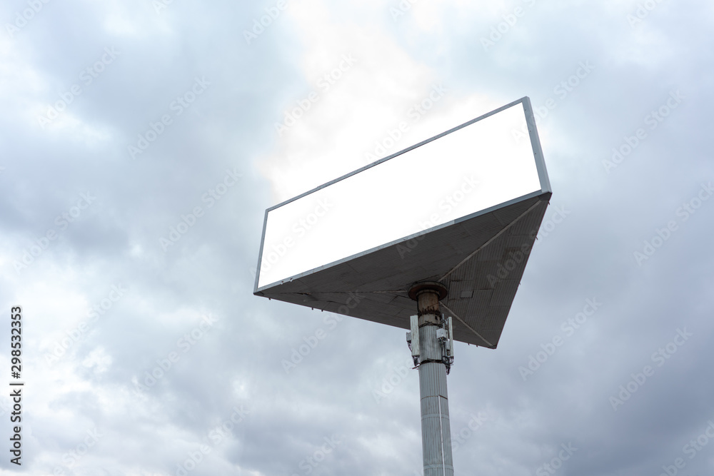 billboard advertising 3 sided large, against the sky. 3-side rotating prism.