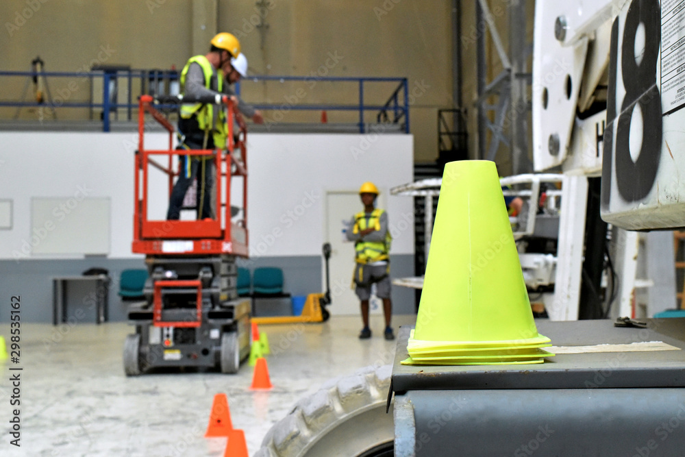 Paterna, Valencia, Spain: 10.18.2019; The yellow traffic cone in the workshop