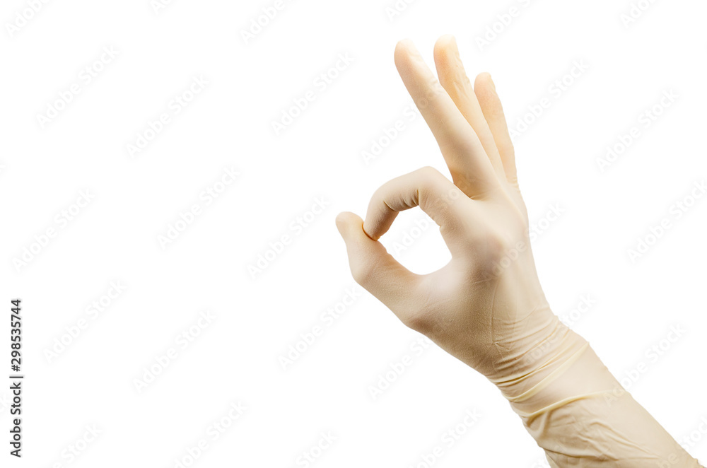 hand showing sign well excellent OK in sterile latex surgical glove isolated on white background hand showing sign well excellent OK in sterile latex surgical glove isolated on white background