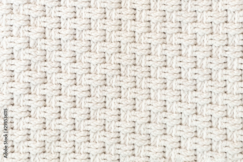 White handmade crochet fabric texture. Knitted background