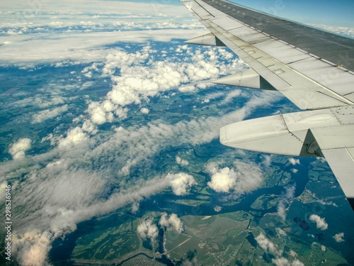 Airplane wing in clouds