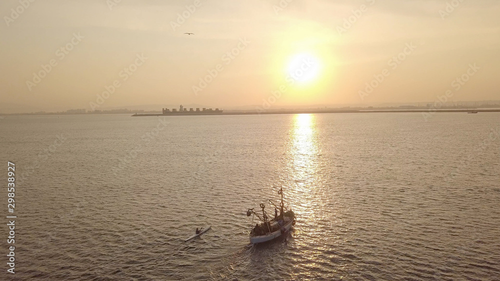 Fishing boat on the background of golden sunrise. Fishing boat on the background of golden sunrise.