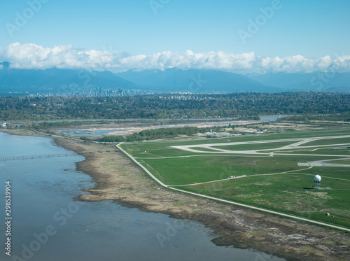 Aerial view of International Airport of Vancouver (VVR) and downtown © Feng