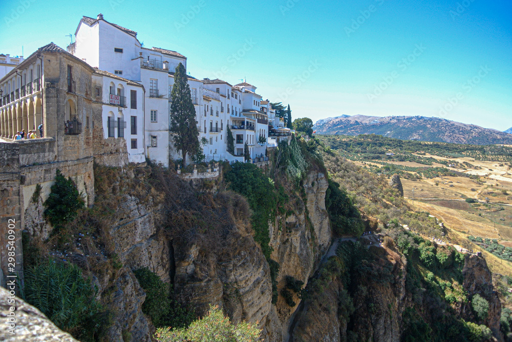 Beautiful city of ronda, Spain. Old buildings in the edge of the canyon and puento nuevo bridge.