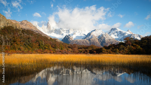 Autumn colors of vegetation around the lagoon Capri with Mount Fitzroy covered by clouds, National Park de los Glaciares, Argentina