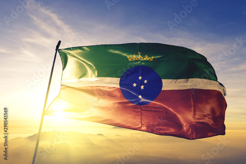Pindamonhangaba of Brazil flag waving on the top sunrise mist fog photo