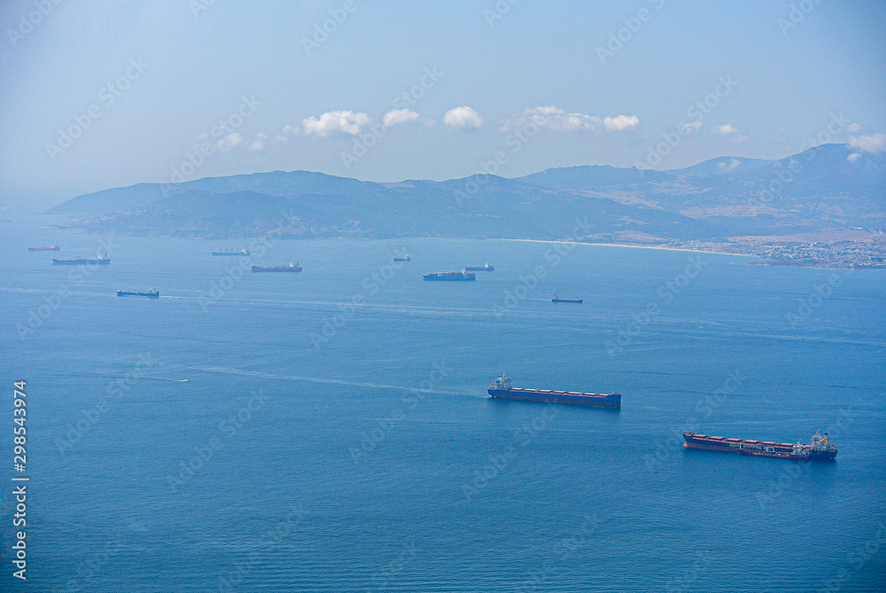 Cargo ships waiting for their turn in the bay of Gibraltar.  Logistics in the Mediterranean Sea.