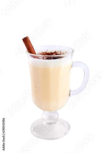 Homemade eggnog with cinnamon isolated on white background. Typical Christmas dessert.
