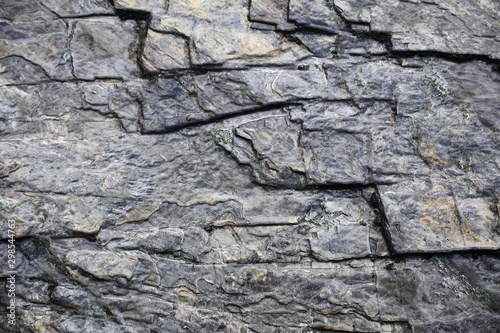 Slate surface with soft reflections of water