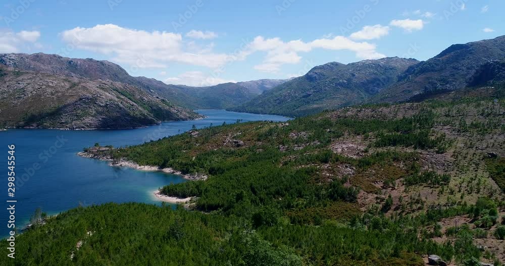 Aerial revealing view of the lake at the Vilarinho das Furnas dam, Peneda Geres National Park, Portugal Aerial revealing view of the lake at the Vilarinho das Furnas dam, Peneda Geres National Park, Portugal