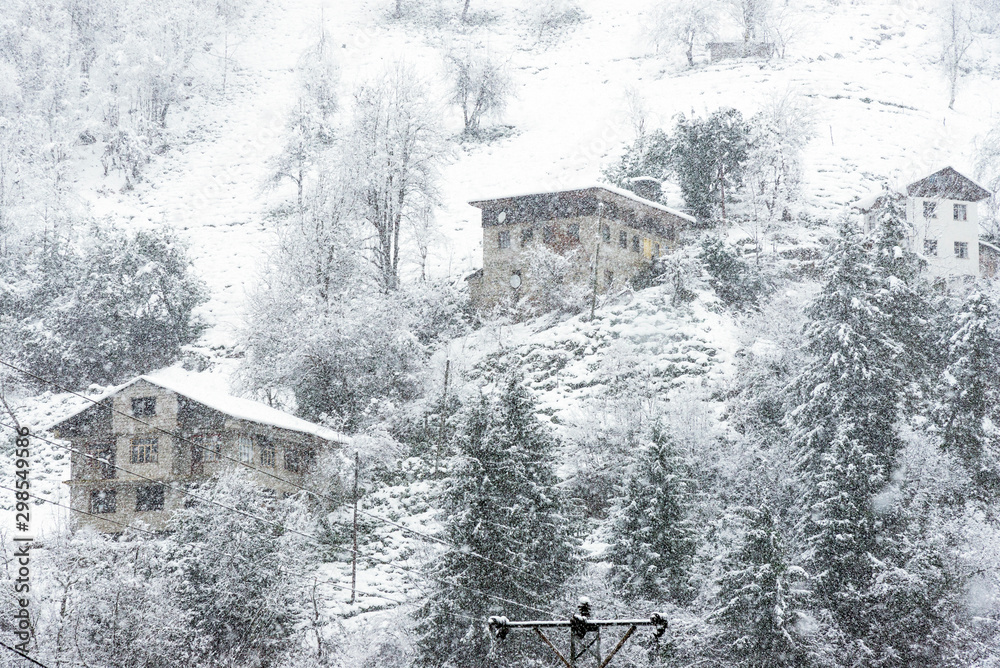 Rize Houses under blizzard in winter.