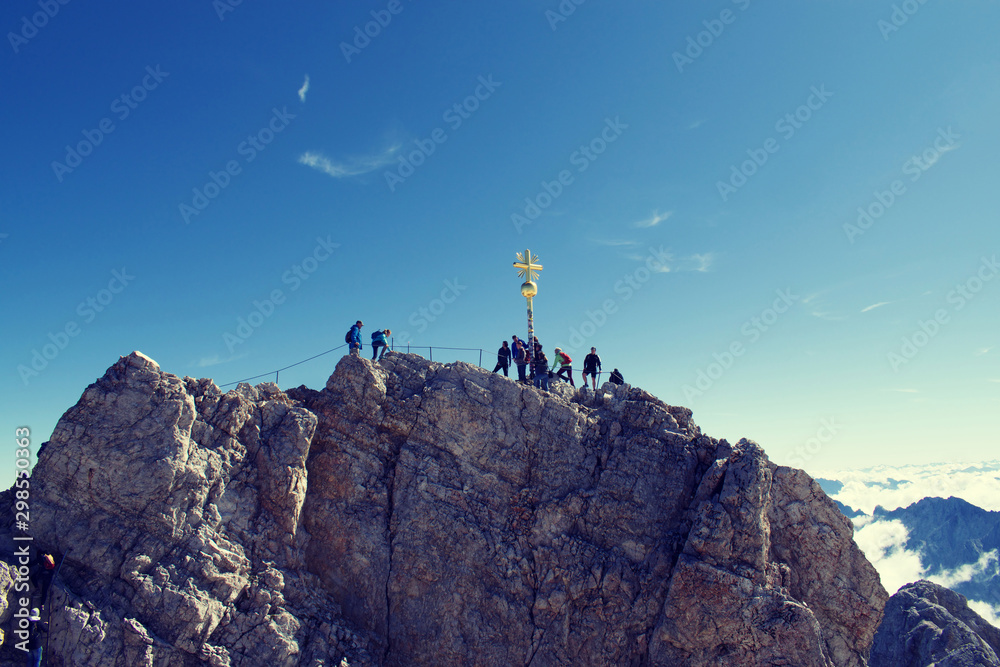 People who have succeed in climbing the mountain, and have reached the top.