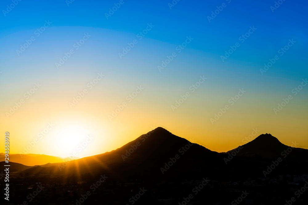Silhouetted Mountain Peaks at Sunset
