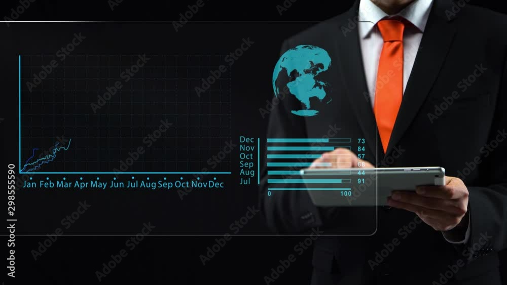 Male uses holographic interface, in black suit working with a tablet ...