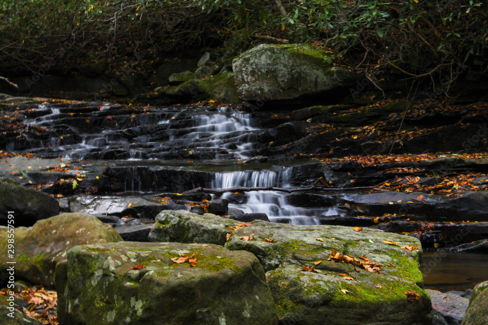 Low level waterfall over several layers of rocks Low level waterfall over several layers of rocks