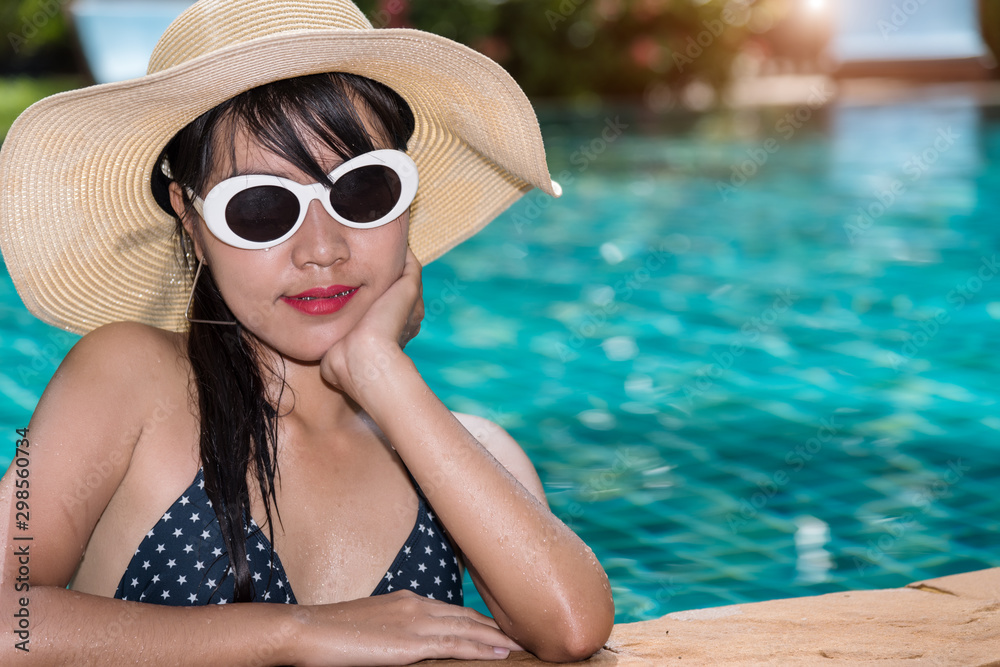 Beautiful lifestyle woman model in bikini with sunglasses fashion at resort Beautiful lifestyle woman model in bikini with sunglasses fashion at resort