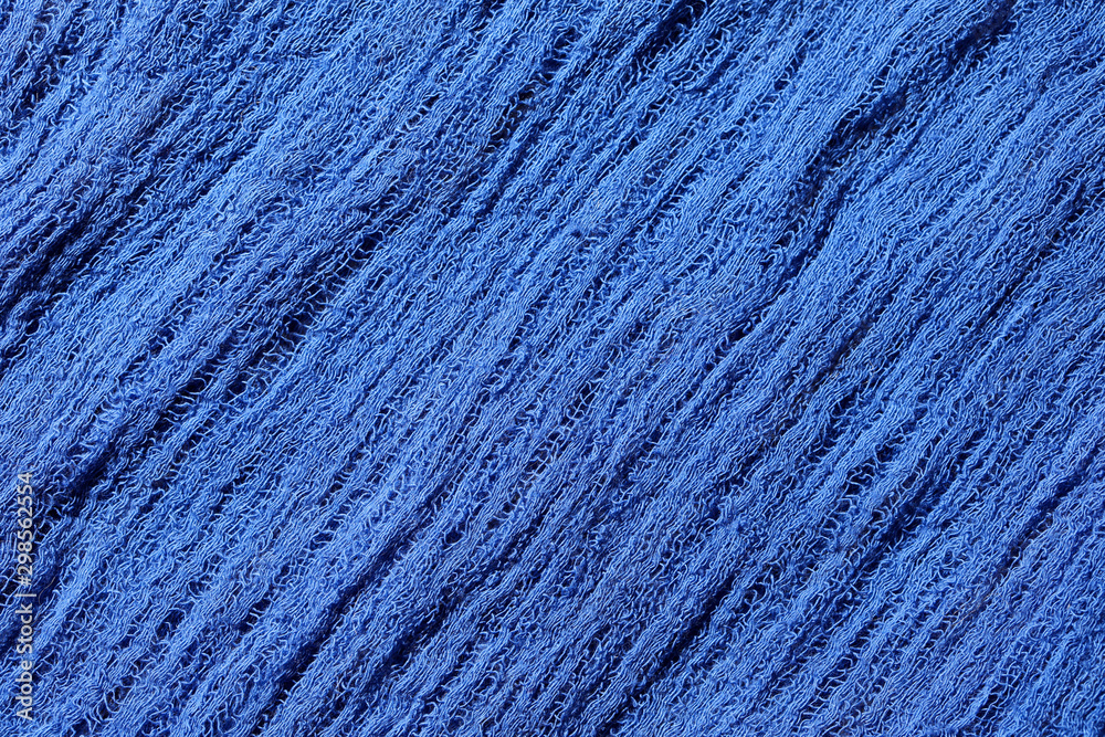 Blue fabric mesh. Rumpled cloth background. Blue fabric mesh. Rumpled cloth background.