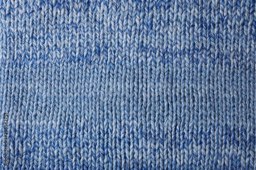 Close up of wool fabric texture. Blue textured Knitted background.