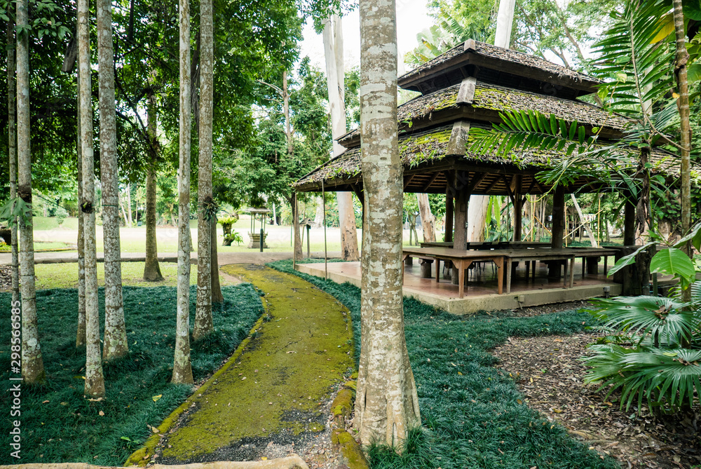 an open wooden house in a park in Bangkok, Thailand an open wooden house in a park in Bangkok, Thailand