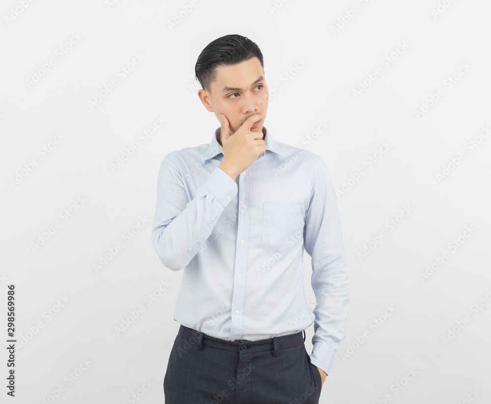 Young handsome asian business man thinking an idea while looking up isolated on white background. Young handsome asian business man thinking an idea while looking up isolated on white background.